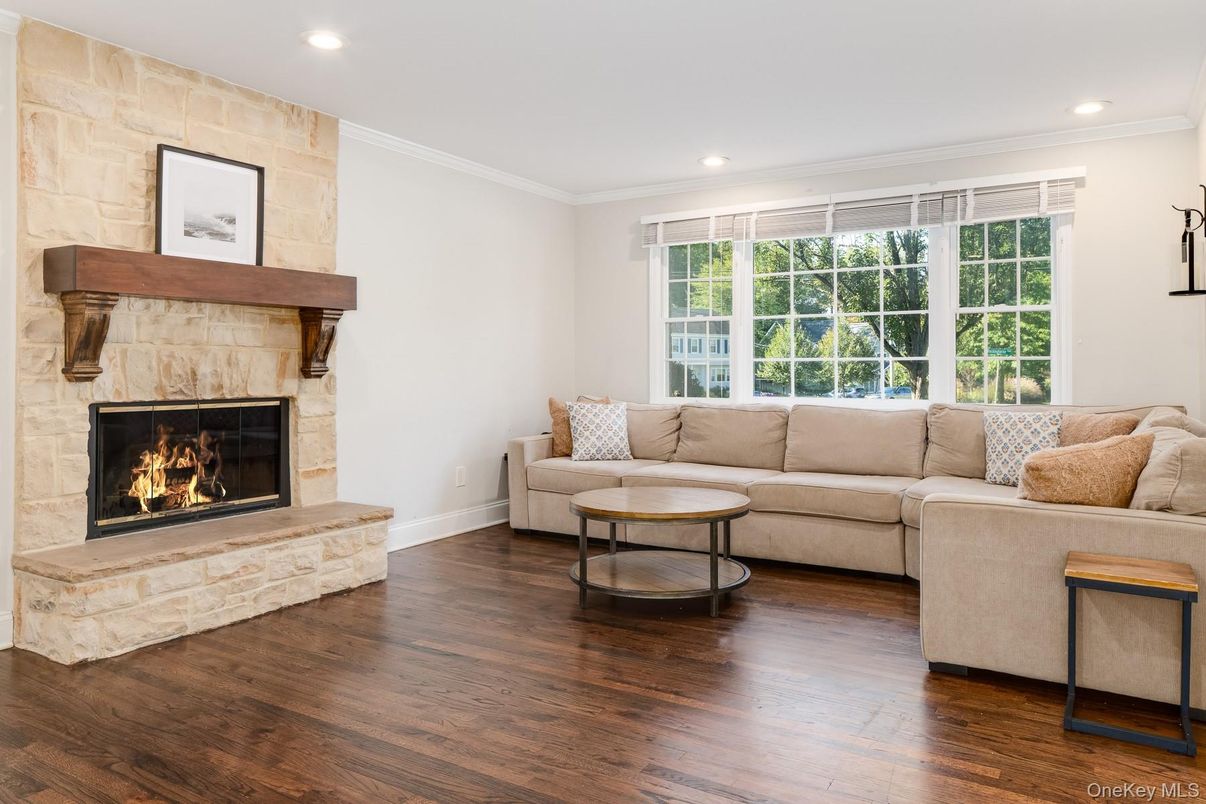 Fireplace, Interior, Living room, Recessed Lighting, Stone Walls, Wood Texture Flooring