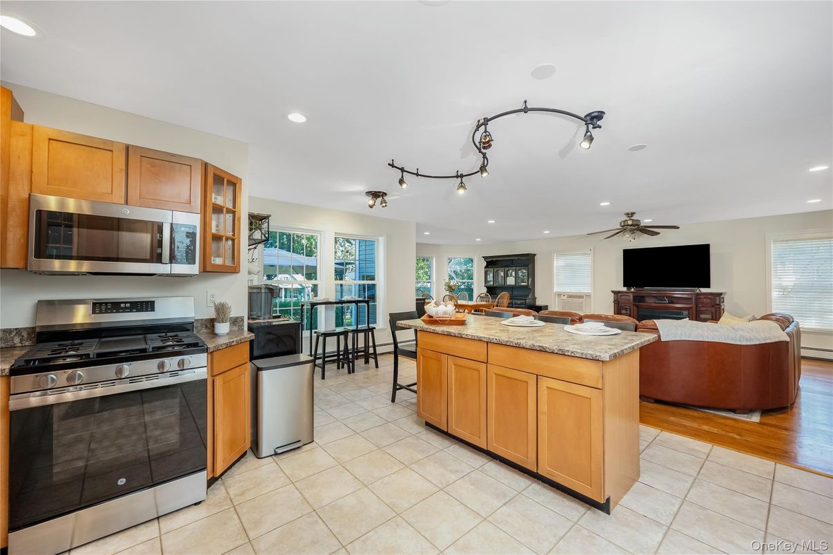 Dining room, Interior, Kitchen, Living room, Recessed Lighting, Stainless Steel Appliances, Wood Texture Flooring