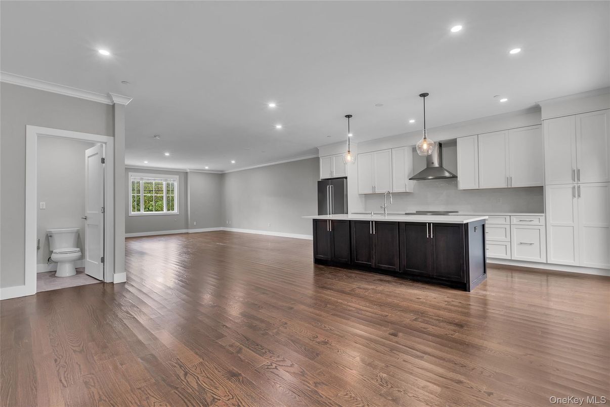 Empty room, Interior, Kitchen, Pendant Lights, Recessed Lighting, Stainless Steel Appliances, Wood Texture Flooring