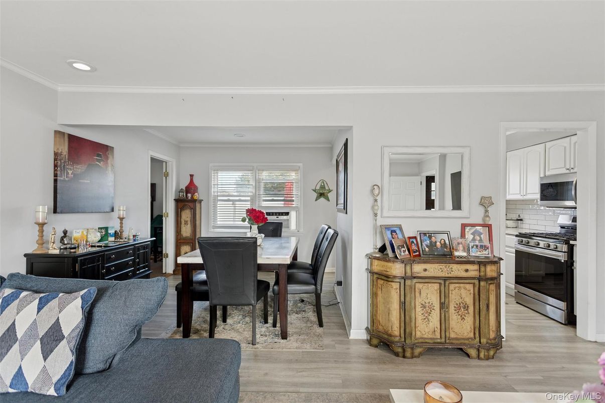 Dining room, Interior, Kitchen, Living room, Recessed Lighting, Stainless Steel Appliances, Wood Texture Flooring
