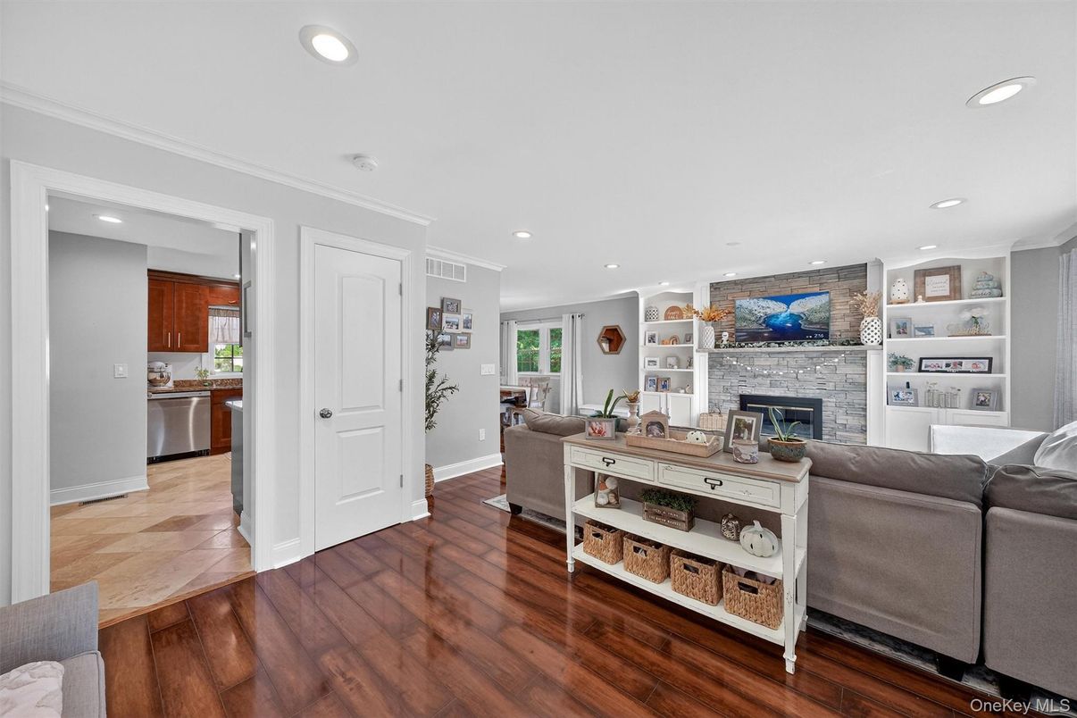 Fireplace, Interior, Kitchen, Living room, Recessed Lighting, Stone Walls, Wood Texture Flooring