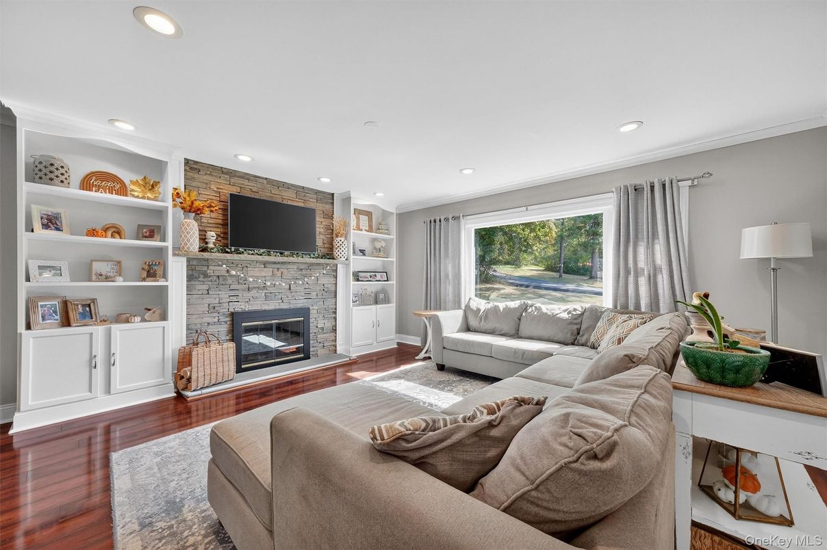 Fireplace, Interior, Living room, Recessed Lighting, Stone Walls, Wood Texture Flooring