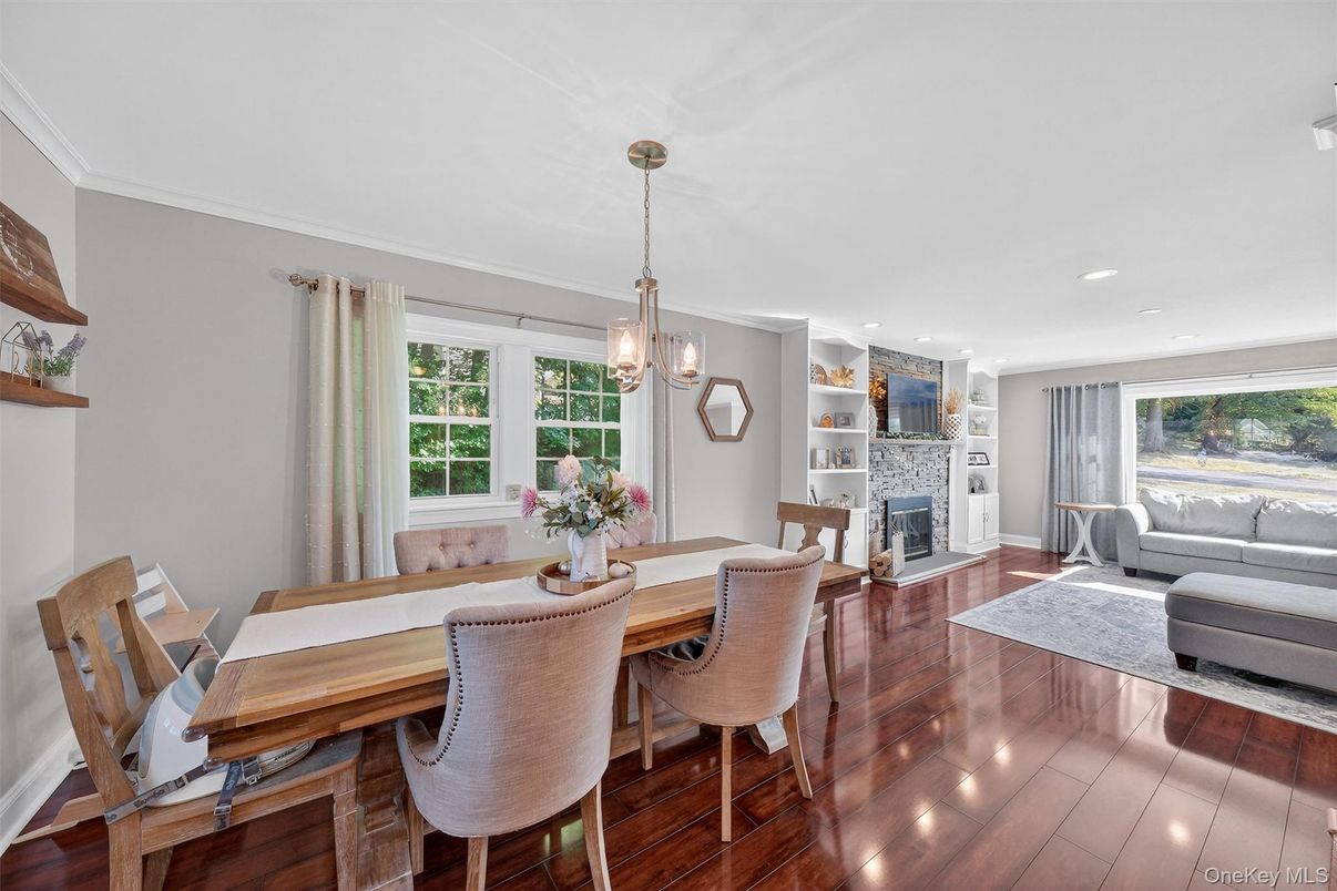 Dining room, Fireplace, Interior, Living room, Pendant Lights, Recessed Lighting, Wood Texture Flooring