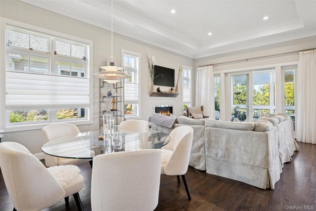 Dining room, Fireplace, Interior, Living room, Pendant Lights, Recessed Lighting, Wood Texture Flooring
