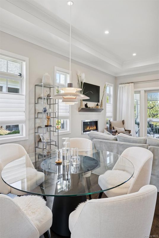 Dining room, Fireplace, Interior, Living room, Pendant Lights, Recessed Lighting, Wood Texture Flooring