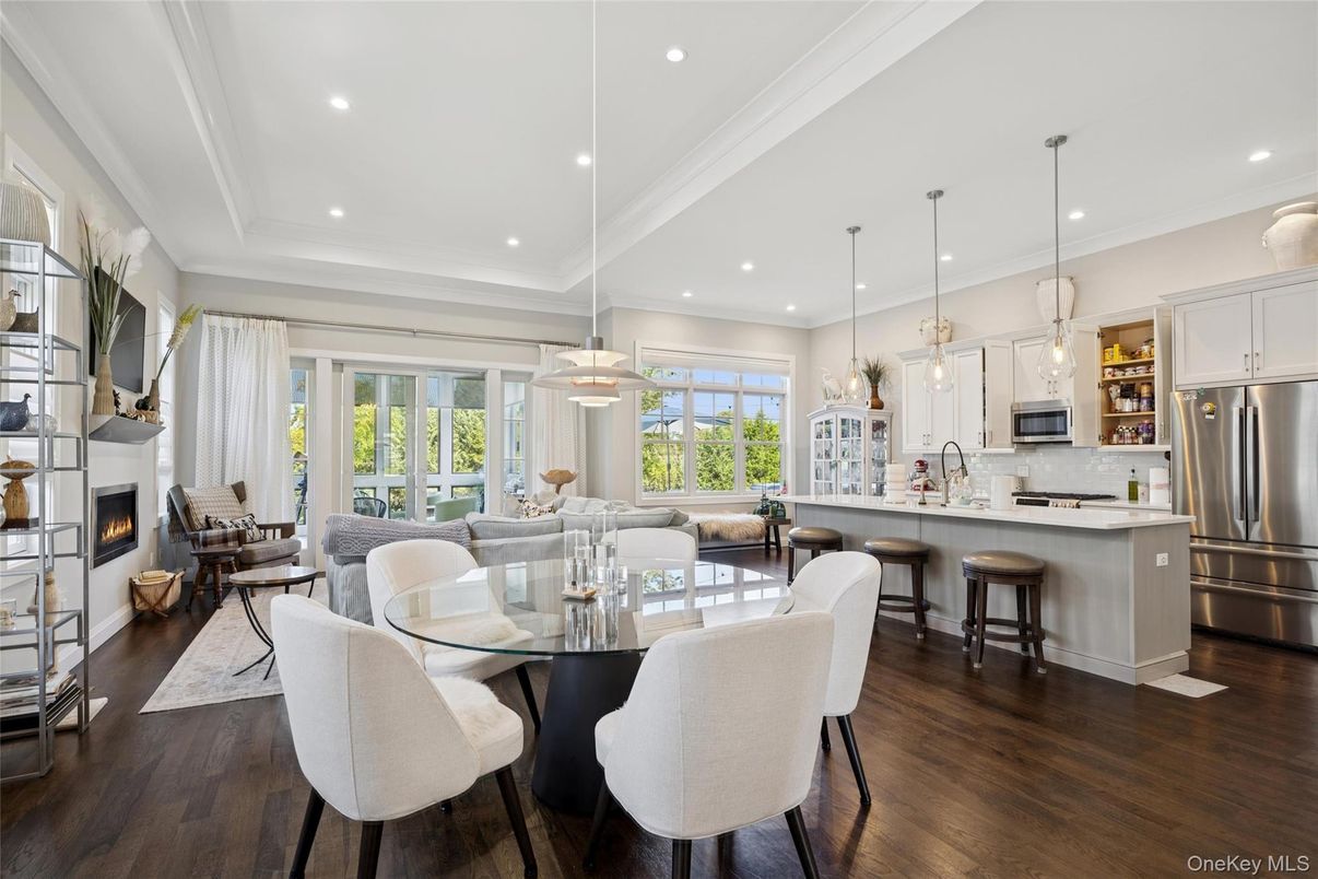 Dining room, Fireplace, Interior, Kitchen, Living room, Pendant Lights, Recessed Lighting, Stainless Steel Appliances, Wood Texture Flooring