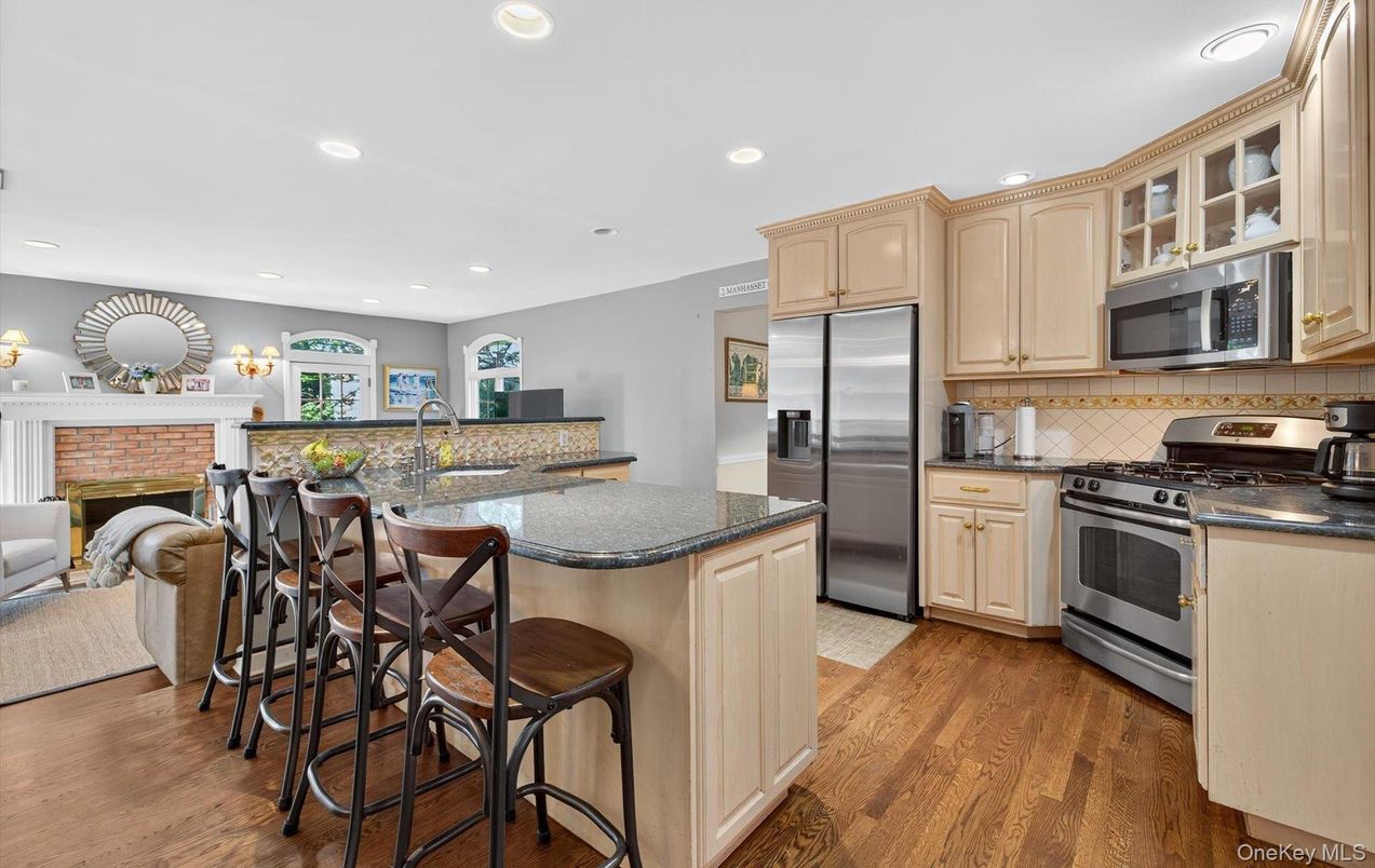 Fireplace, Interior, Kitchen, Recessed Lighting, Stainless Steel Appliances, Wood Texture Flooring