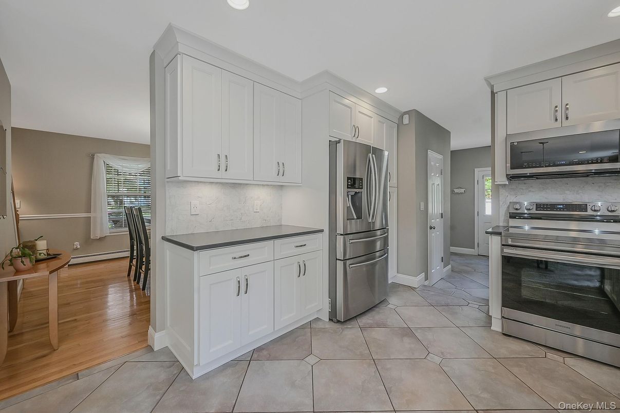 Dining room, Interior, Kitchen, Recessed Lighting, Stainless Steel Appliances, Wood Texture Flooring