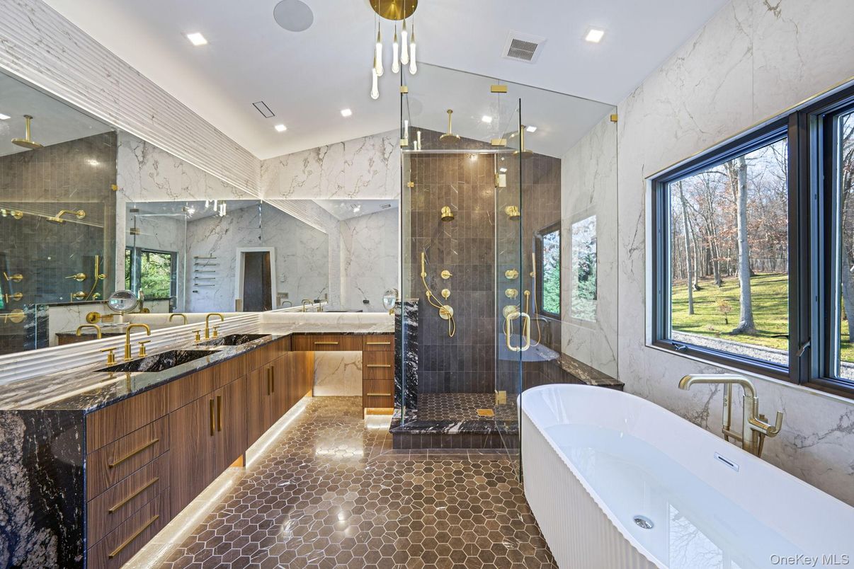 Bathroom, Dual Sink Vanities, Free Standing Baths, Glass Shower, Interior, Marble Walls, Recessed Lighting