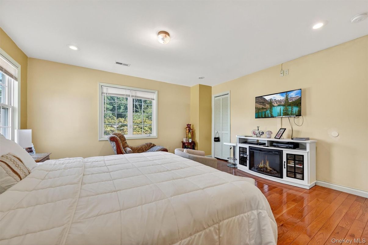Bedroom, Fireplace, Interior, Recessed Lighting, Wood Texture Flooring
