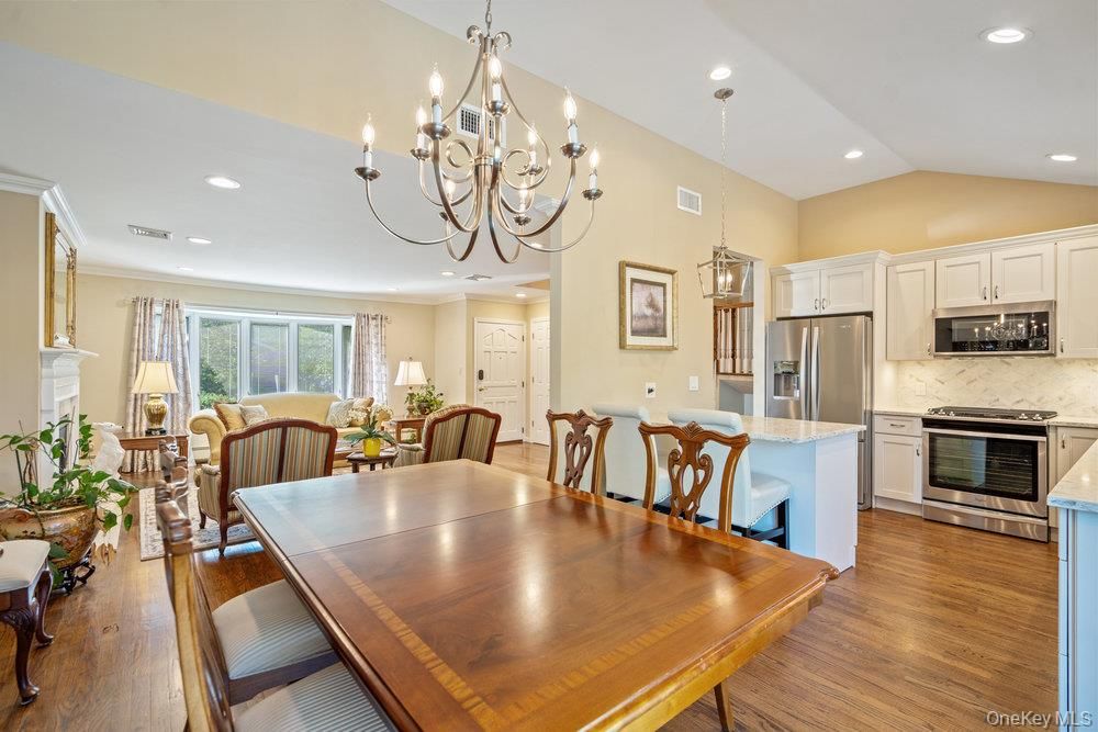 Chandelier, Dining room, Interior, Kitchen, Pendant Lights, Recessed Lighting, Stainless Steel Appliances, Wood Texture Flooring