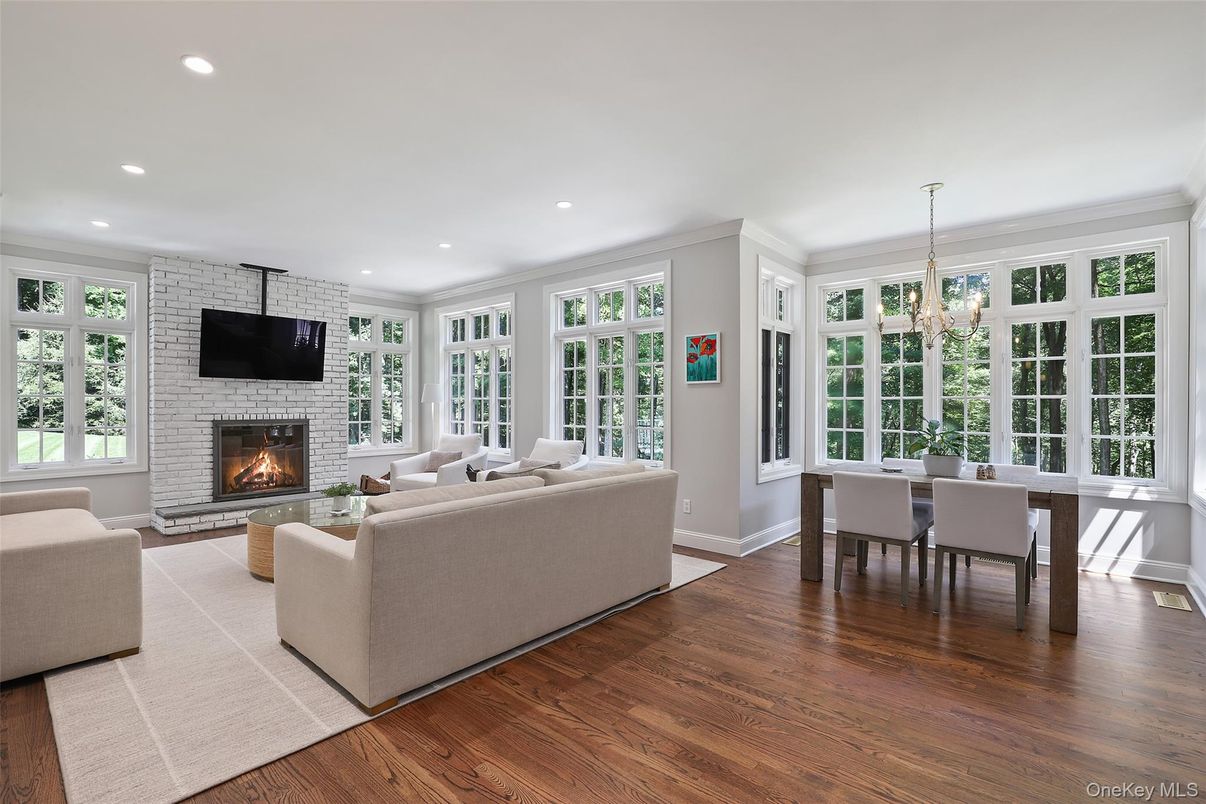 Chandelier, Dining room, Fireplace, Interior, Living room, Recessed Lighting, Stone Walls, Wood Texture Flooring