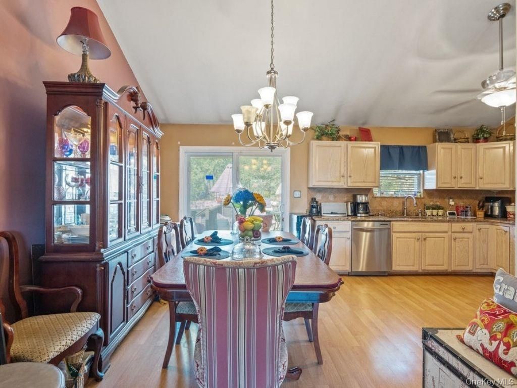 Chandelier, Dining room, Interior, Kitchen, Stainless Steel Appliances, Wood Texture Flooring