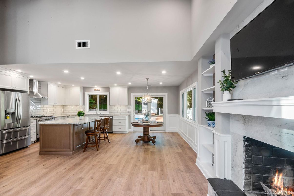 Fireplace, Interior, Kitchen, Pendant Lights, Recessed Lighting, Stainless Steel Appliances, Wood Texture Flooring