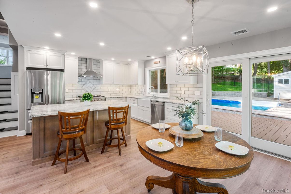 Dining room, Interior, Kitchen, Pendant Lights, Recessed Lighting, Stainless Steel Appliances, Wood Texture Flooring