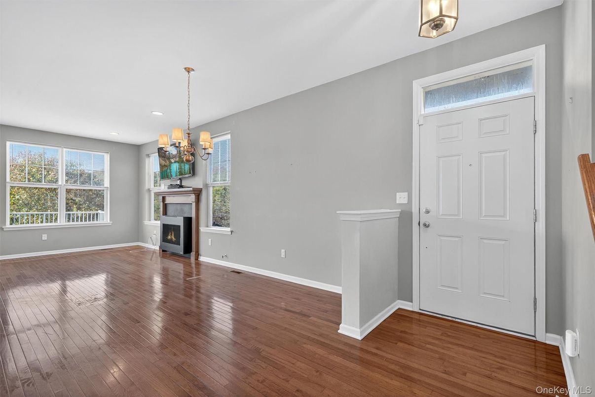 Chandelier, Empty room, Fireplace, Interior, Recessed Lighting, Wood Texture Flooring