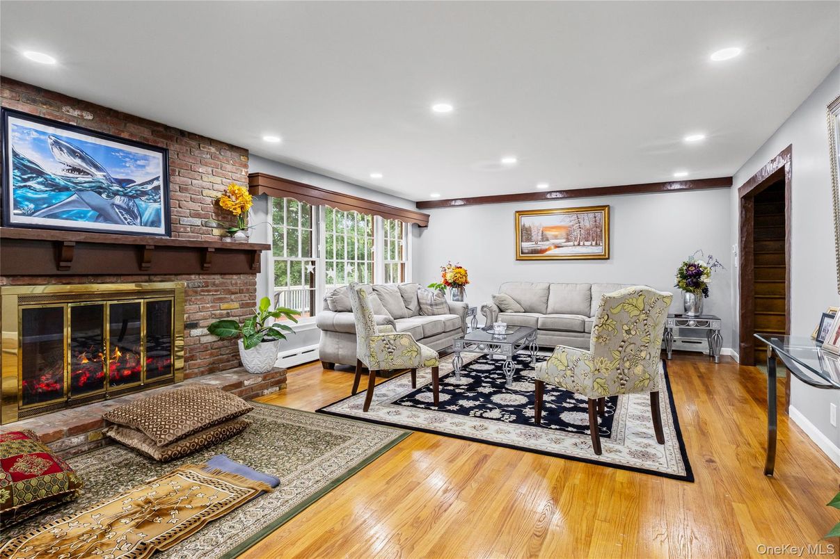 Fireplace, Interior, Living room, Recessed Lighting, Stone Walls, Wood Texture Flooring