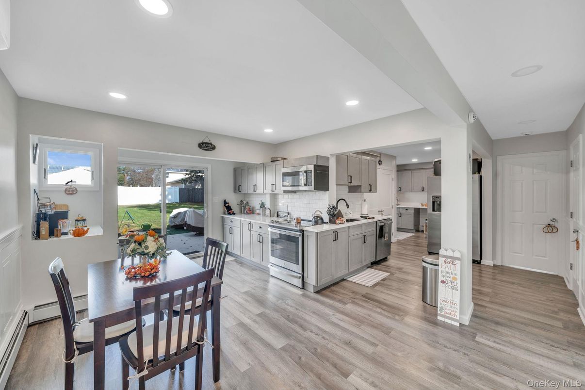 Dining room, Interior, Kitchen, Recessed Lighting, Stainless Steel Appliances, Wood Texture Flooring