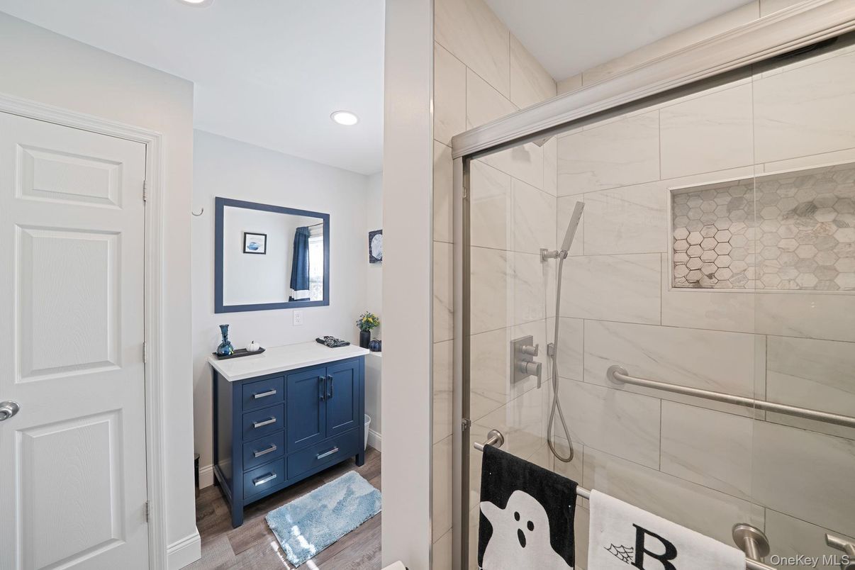 Bathroom, Glass Shower, Interior, Marble Walls, Recessed Lighting, Wood Texture Flooring