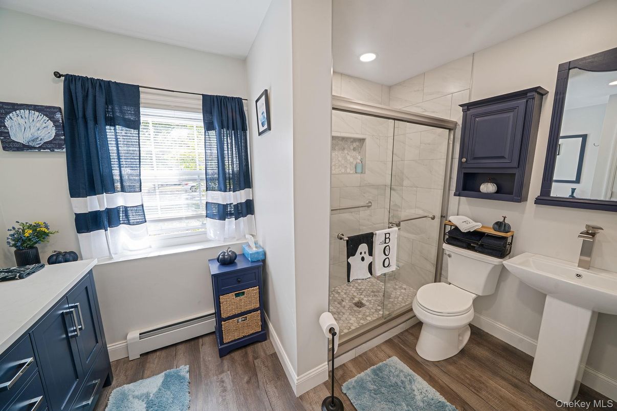 Bathroom, Glass Shower, Interior, Marble Walls, Recessed Lighting, Wood Texture Flooring