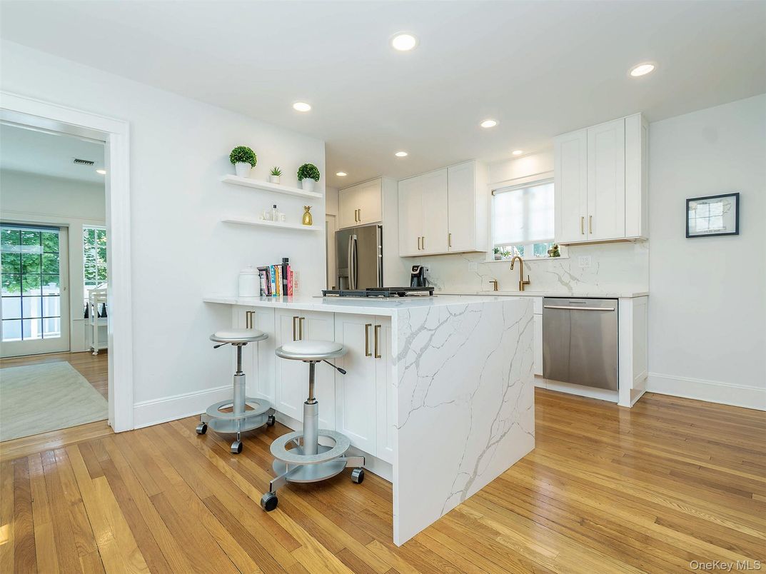Interior, Kitchen, Marble Walls, Recessed Lighting, Stainless Steel Appliances, Wood Texture Flooring