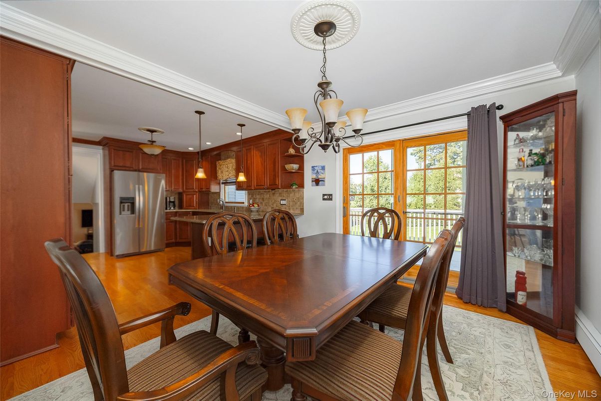 Chandelier, Dining room, Interior, Kitchen, Pendant Lights, Stainless Steel Appliances, Wood Texture Flooring