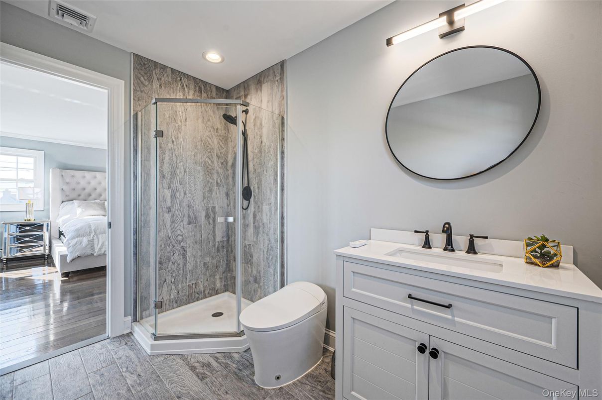 Bathroom, Bedroom, Glass Shower, Interior, Recessed Lighting, Wood Texture Flooring