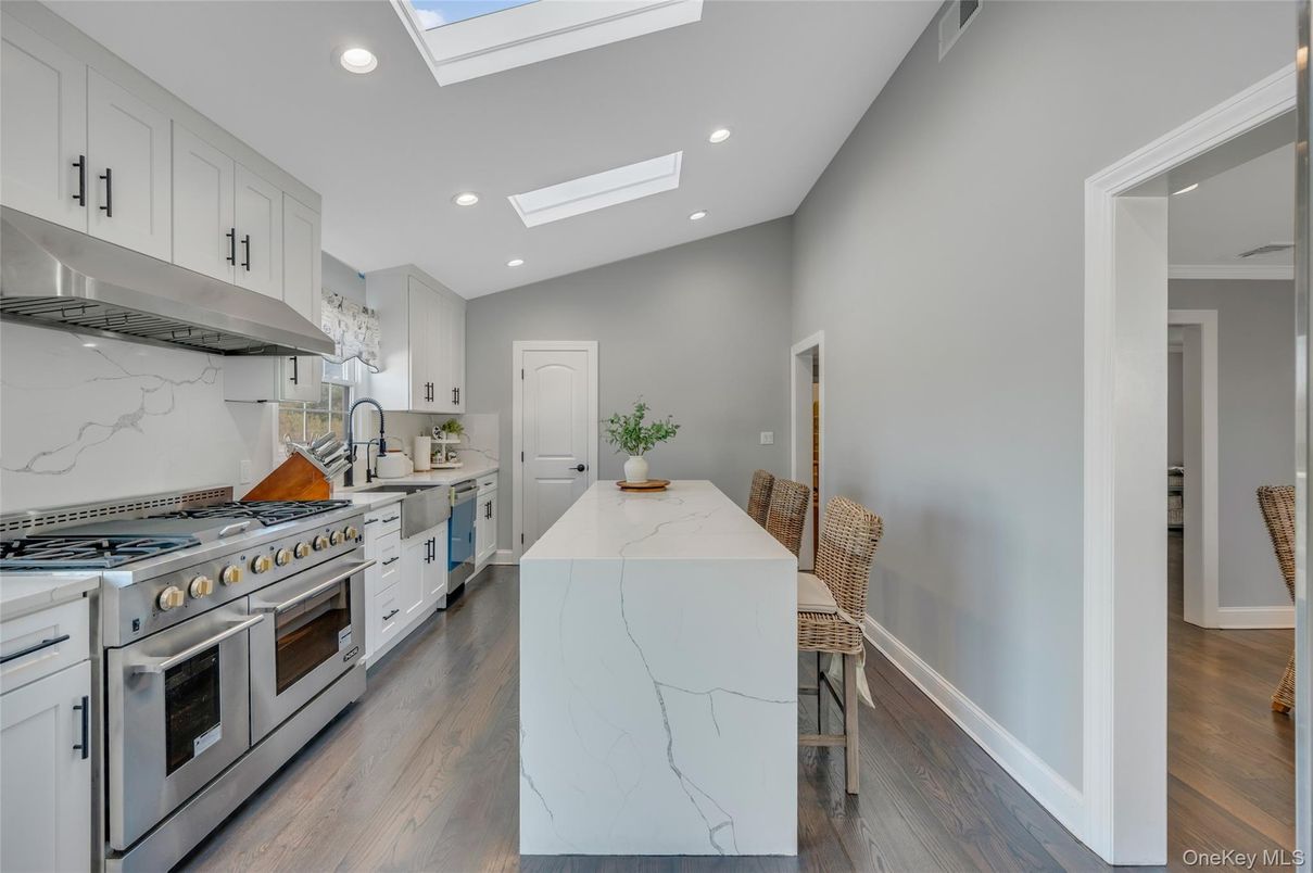 Interior, Kitchen, Marble Walls, Recessed Lighting, Stainless Steel Appliances, Wood Texture Flooring