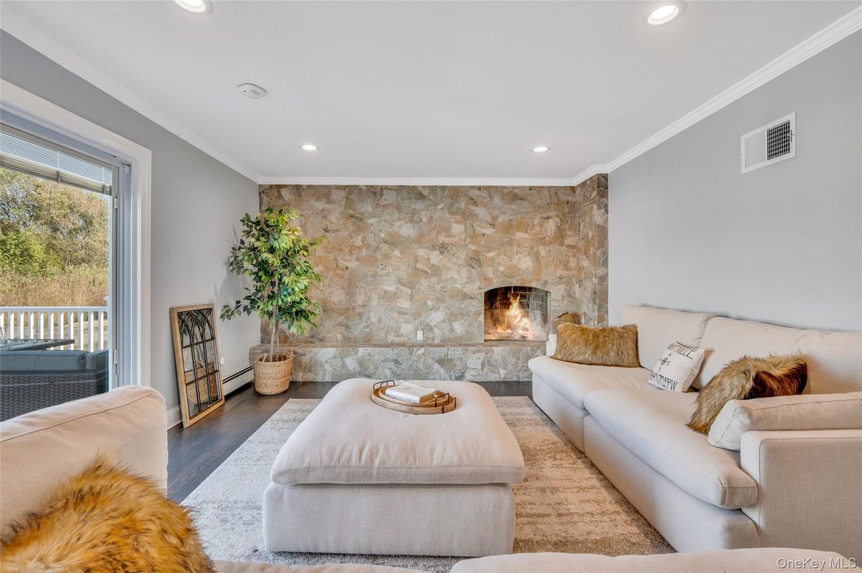 Fireplace, Interior, Living room, Recessed Lighting, Stone Walls, Wood Texture Flooring