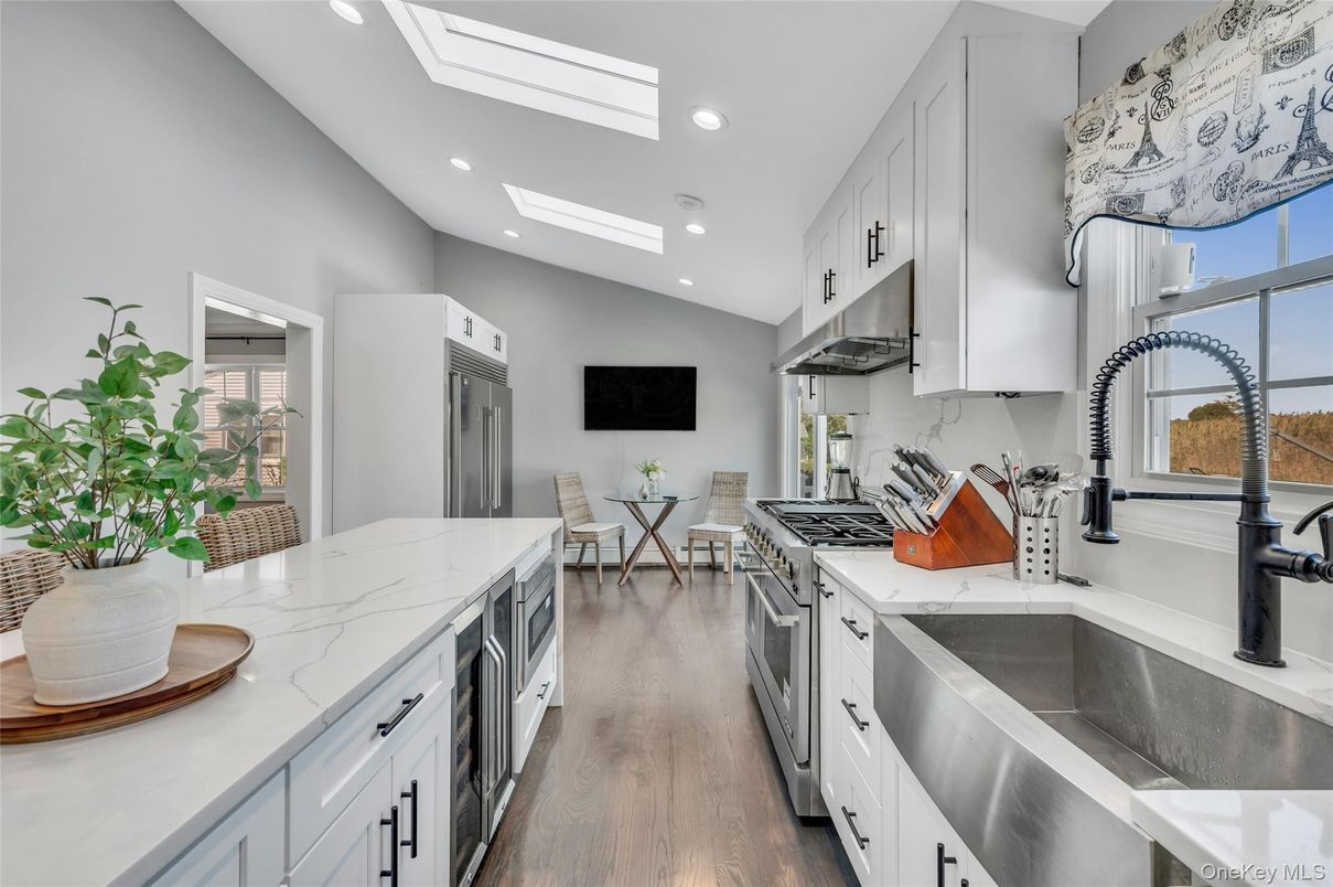 Dining room, Interior, Kitchen, Recessed Lighting, Stainless Steel Appliances, Wood Texture Flooring