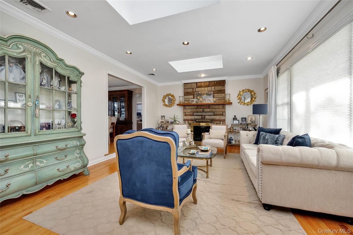 Fireplace, Interior, Living room, Recessed Lighting, Stone Walls, Wood Texture Flooring