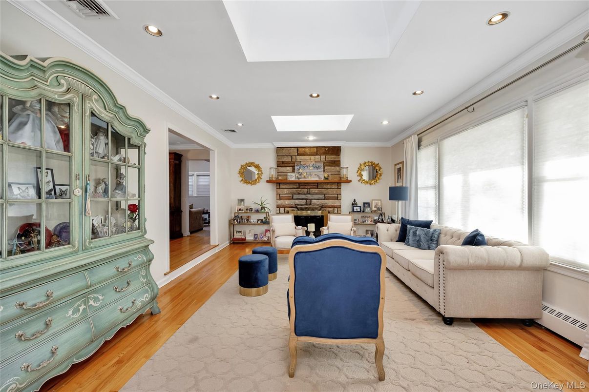 Fireplace, Interior, Living room, Recessed Lighting, Stone Walls, Wood Texture Flooring