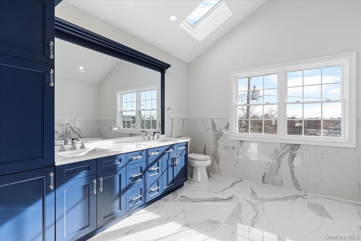 Bathroom, Dual Sink Vanities, Interior, Marble, Marble Walls, Recessed Lighting
