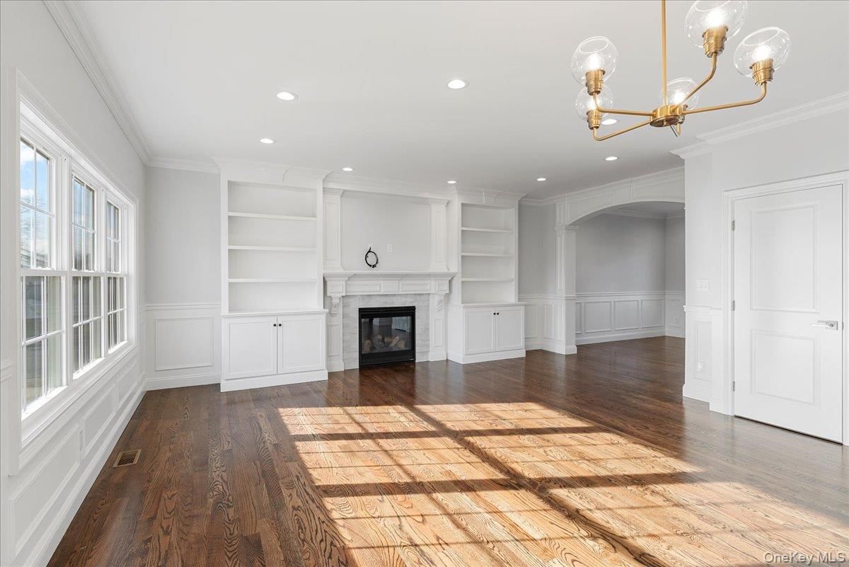 Chandelier, Empty room, Fireplace, Interior, Recessed Lighting, Wood Texture Flooring