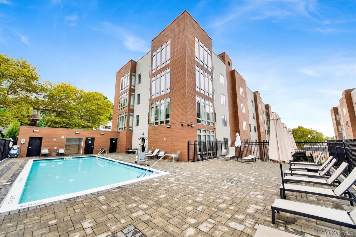 Exterior, Facade, Pool, Condo Building