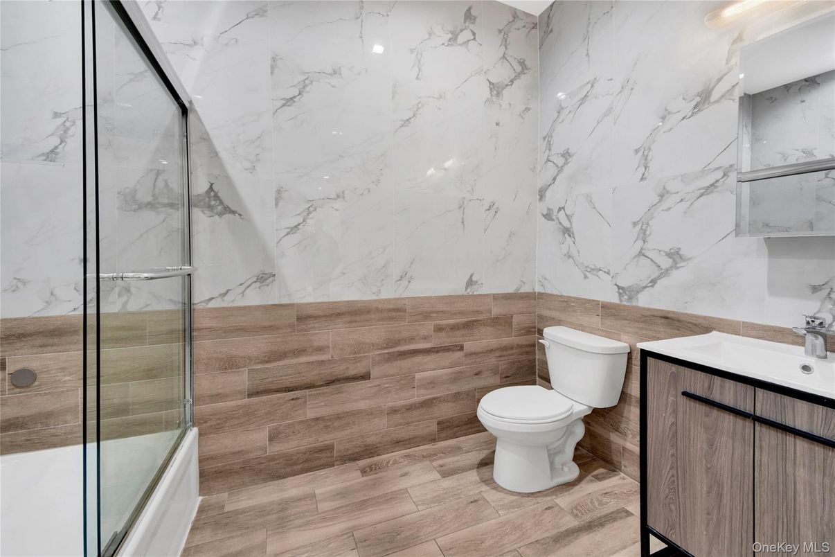 Bathroom, Glass Shower, Interior, Marble Walls, Wood Texture Flooring
