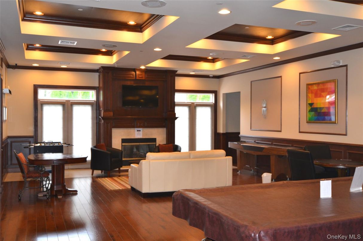 Billiard Table, Dining room, Fireplace, Game Room, Interior, Living room, Piano, Recessed Lighting, Wood Texture Flooring