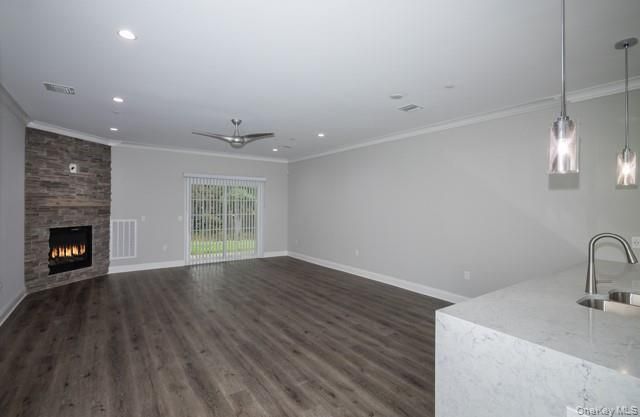 Empty room, Fireplace, Interior, Kitchen, Pendant Lights, Recessed Lighting, Stone Walls, Wood Texture Flooring