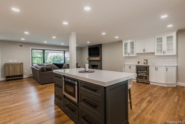 Fireplace, Interior, Kitchen, Living room, Recessed Lighting, Wood Texture Flooring