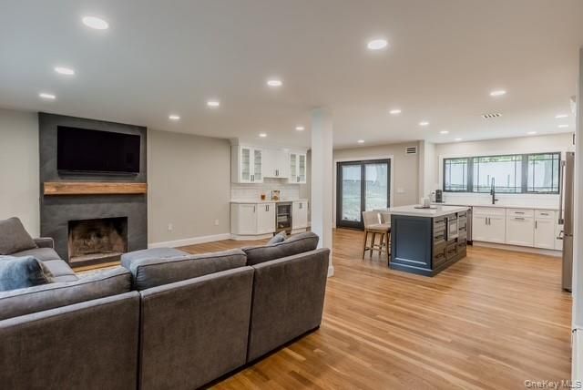 Dining room, Fireplace, Interior, Kitchen, Living room, Recessed Lighting, Wood Texture Flooring