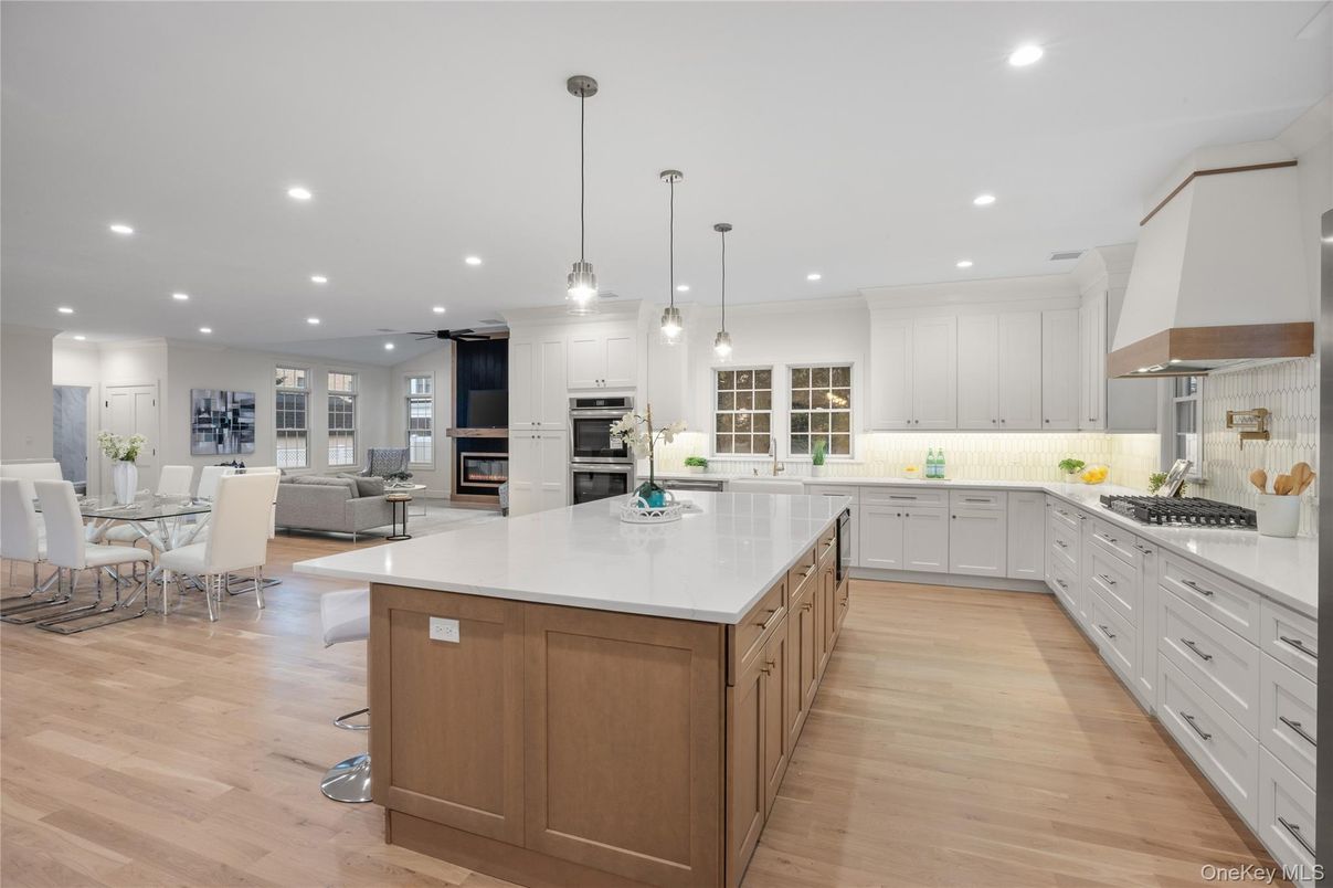 Dining room, Interior, Kitchen, Living room, Pendant Lights, Recessed Lighting, Stainless Steel Appliances, Wood Texture Flooring