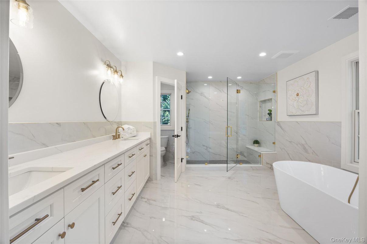 Bathroom, Dual Sink Vanities, Free Standing Baths, Glass Shower, Interior, Marble, Marble Walls, Recessed Lighting