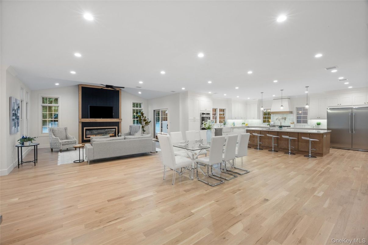 Dining room, Fireplace, Interior, Kitchen, Living room, Pendant Lights, Recessed Lighting, Stainless Steel Appliances, Wood Texture Flooring