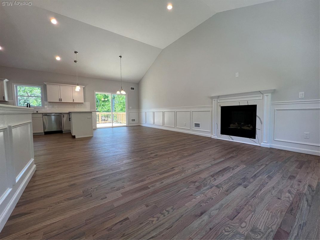 Empty room, Fireplace, Interior, Kitchen, Pendant Lights, Recessed Lighting, Wood Texture Flooring