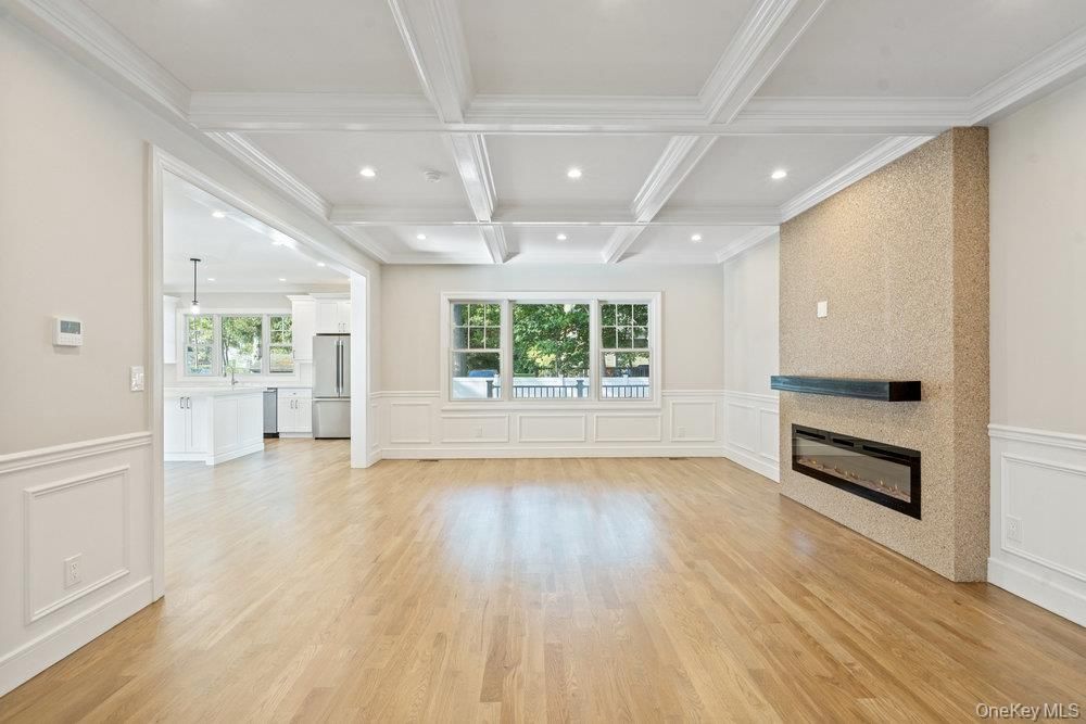 Empty room, Fireplace, Interior, Pendant Lights, Recessed Lighting, Wood Texture Flooring