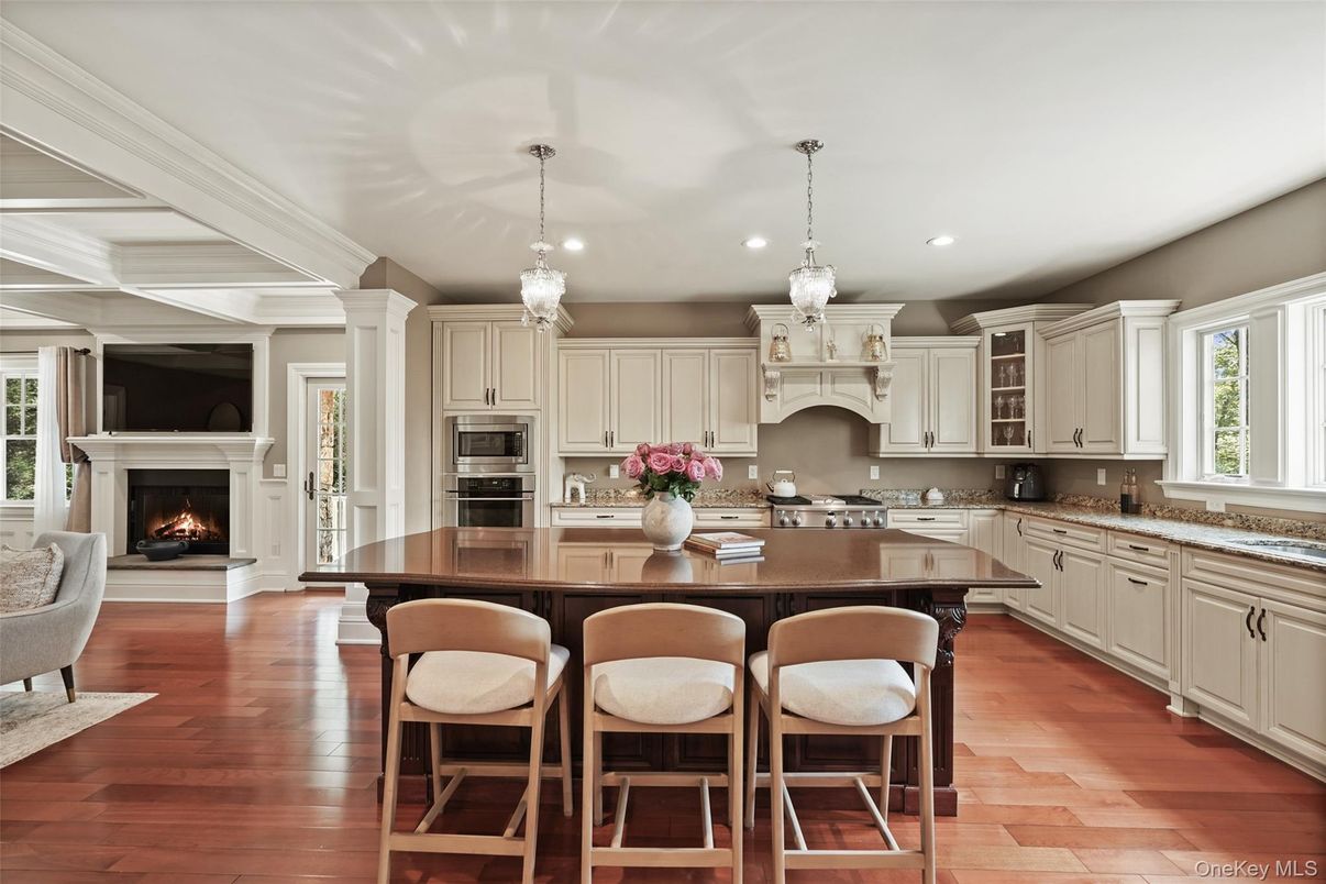 Chandelier, Fireplace, Interior, Kitchen, Pendant Lights, Recessed Lighting, Stainless Steel Appliances, Wood Texture Flooring