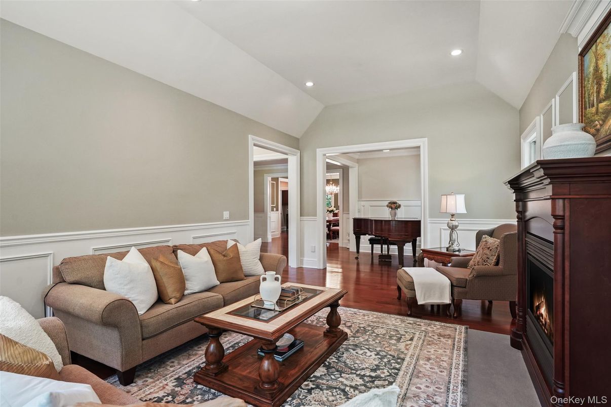 Fireplace, Interior, Living room, Piano, Recessed Lighting, Wood Texture Flooring