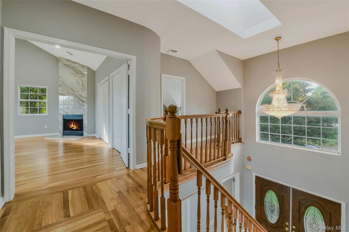 Chandelier, Fireplace, Interior, Marble Walls, Pendant Lights, Wood Texture Flooring