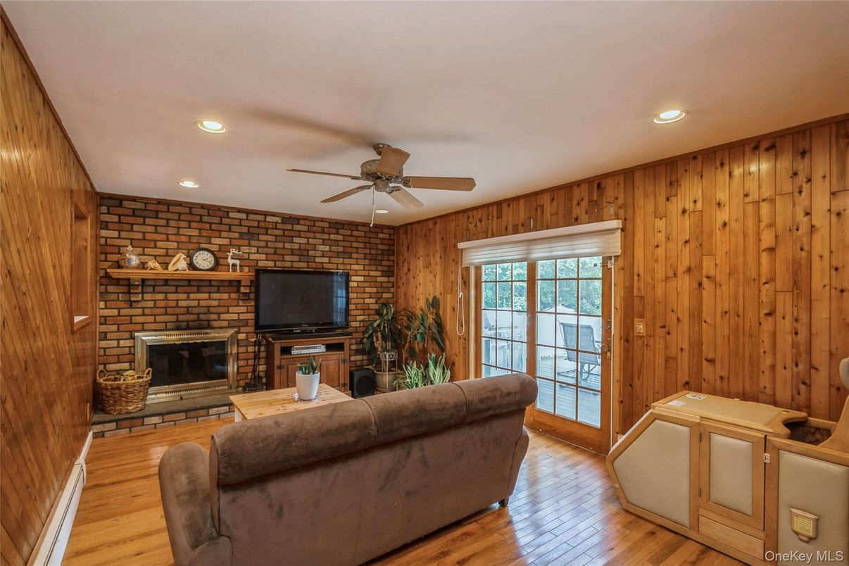 Fireplace, Interior, Living room, Recessed Lighting, Stone Walls, Wood Texture Flooring, Wooden Walls