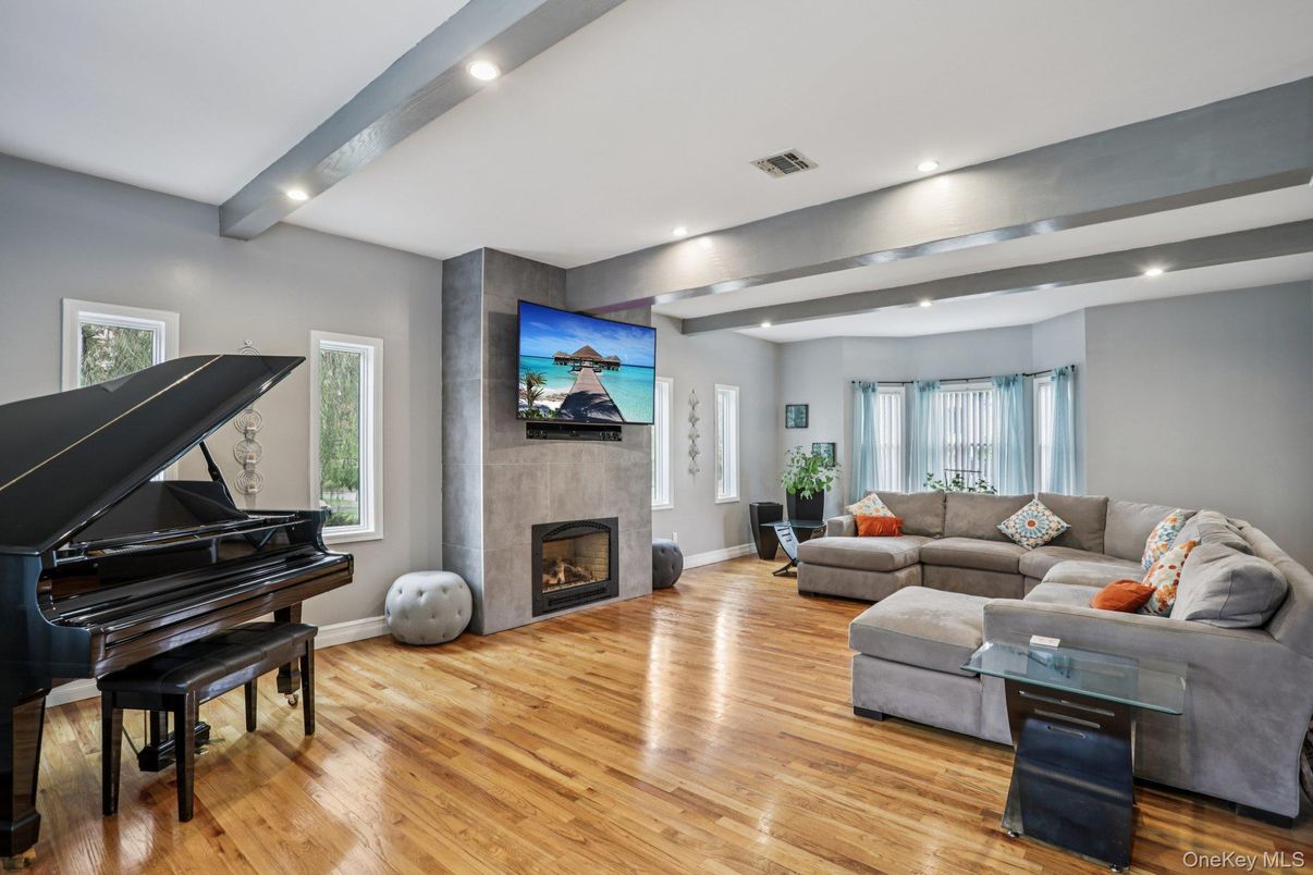 Fireplace, Interior, Living room, Piano, Recessed Lighting, Wood Texture Flooring